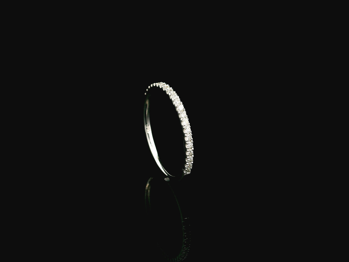 GIA certified cushion cut diamond bridal ring set in 18K white gold with halo engagement ring and matching diamond wedding band.