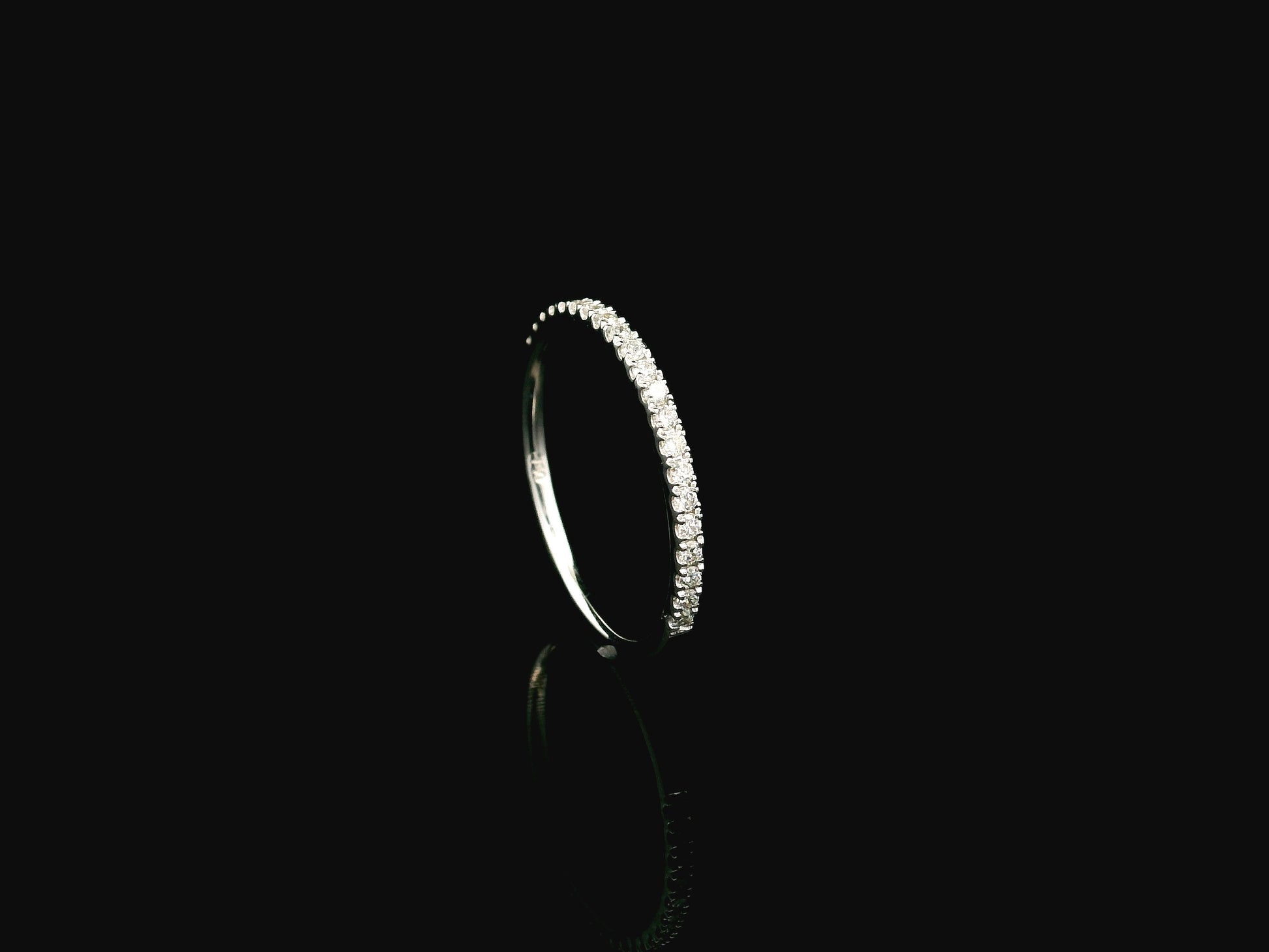 GIA certified cushion cut diamond bridal ring set in 18K white gold with halo engagement ring and matching diamond wedding band.