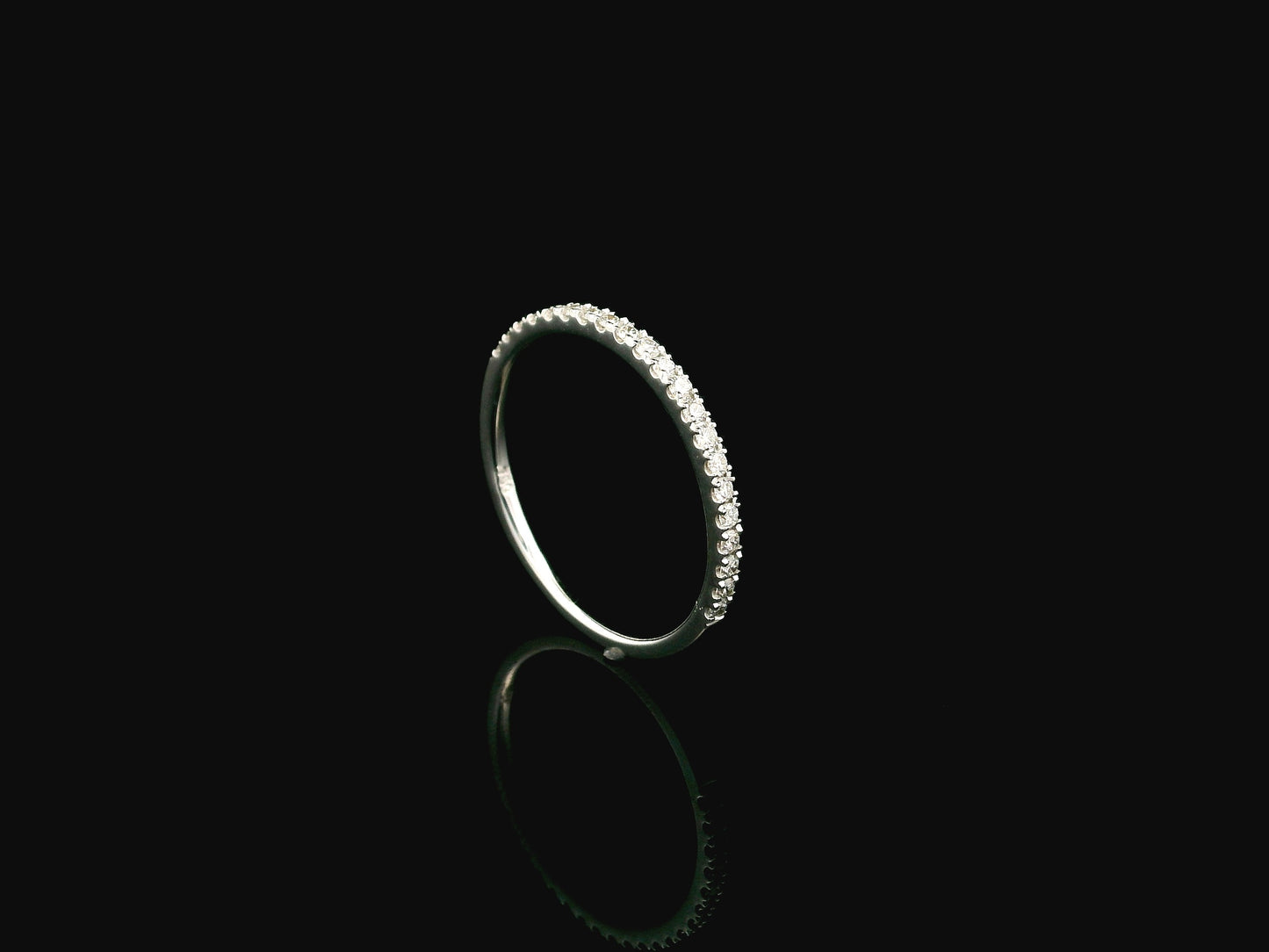 GIA certified cushion cut diamond bridal ring set in 18K white gold with halo engagement ring and matching diamond wedding band.