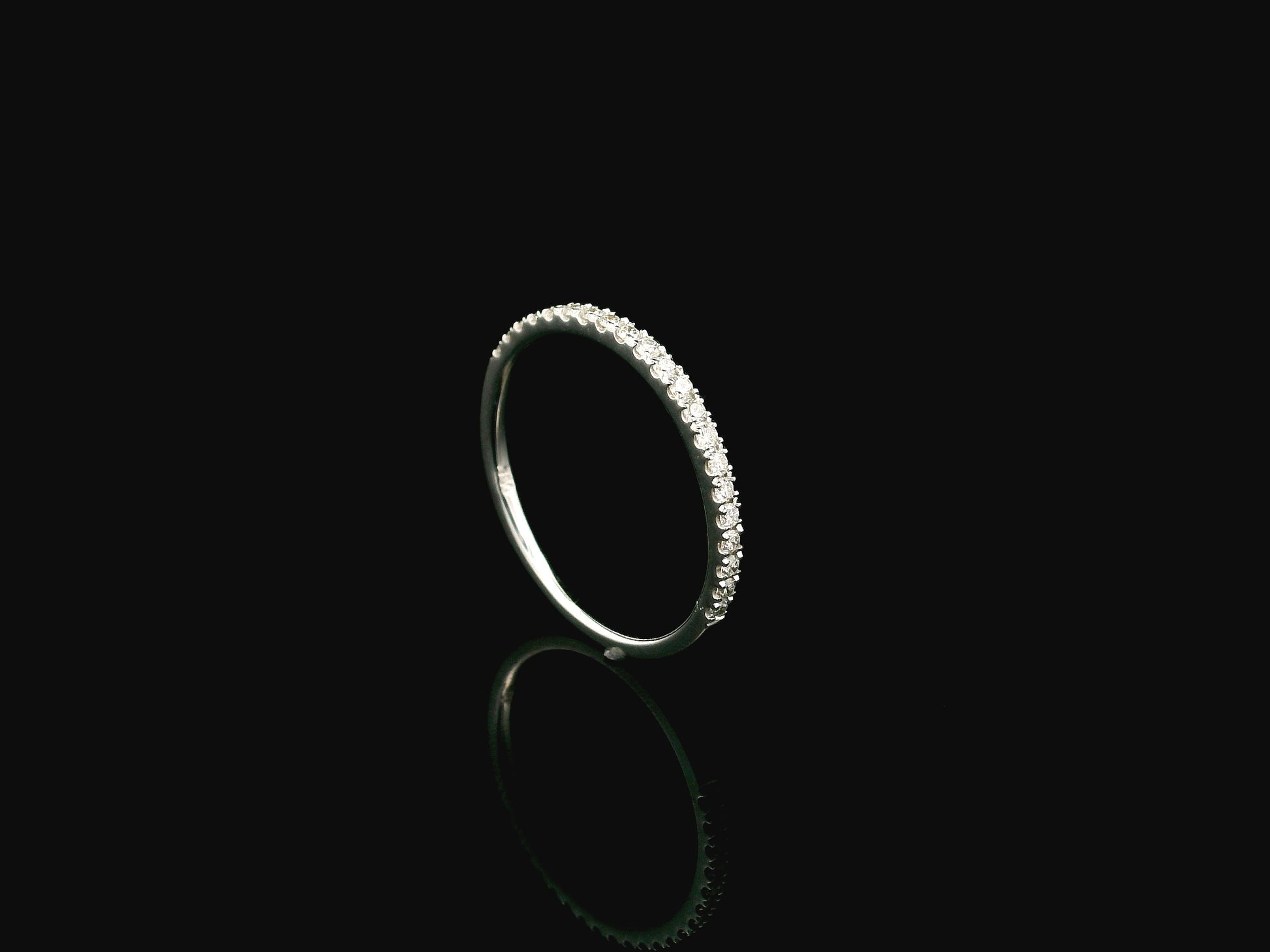 GIA certified cushion cut diamond bridal ring set in 18K white gold with halo engagement ring and matching diamond wedding band.