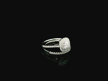 GIA certified cushion cut diamond bridal ring set in 18K white gold with halo engagement ring and matching diamond wedding band.