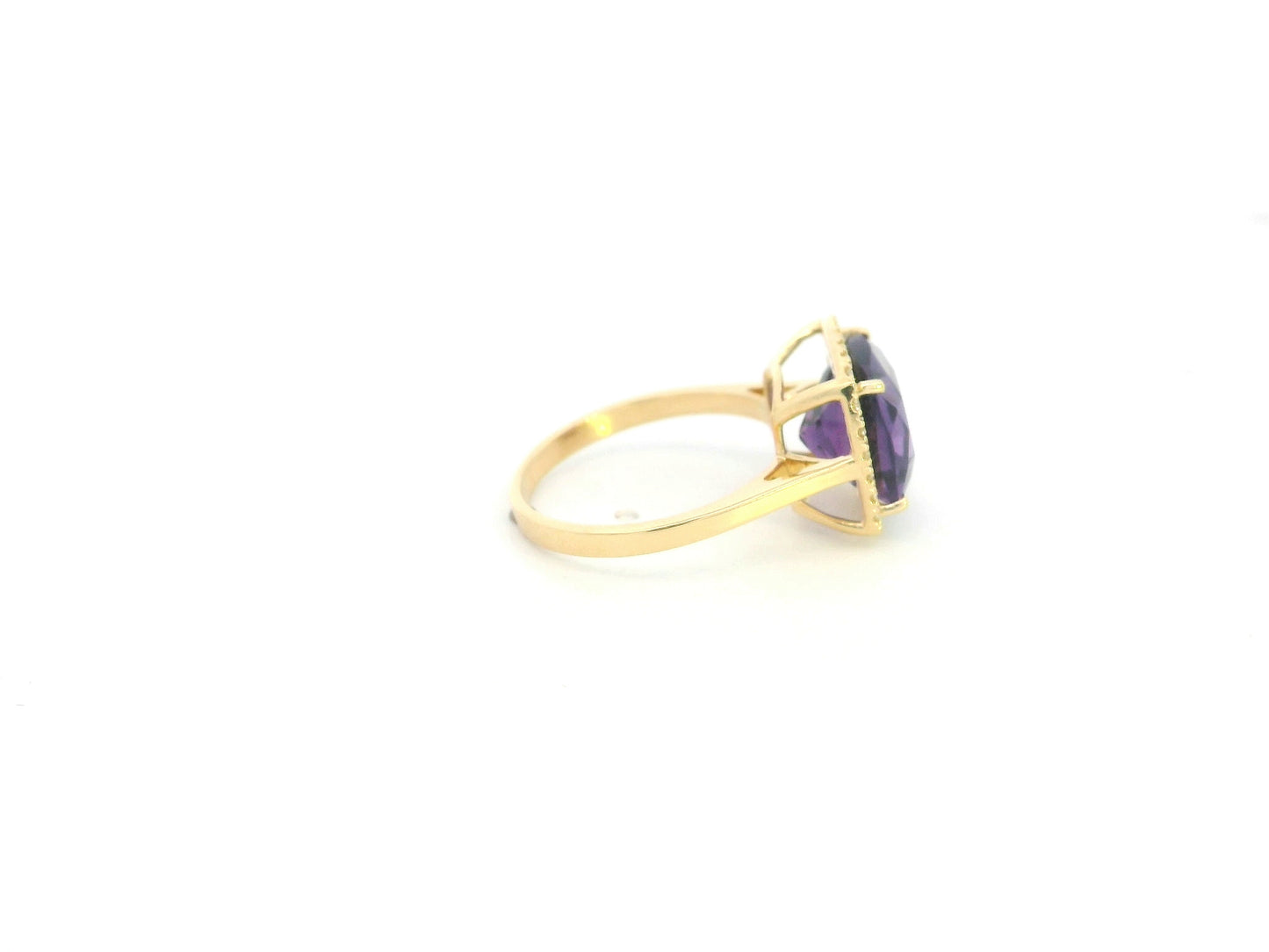18K yellow gold cushion-cut amethyst halo ring with natural diamond accents.