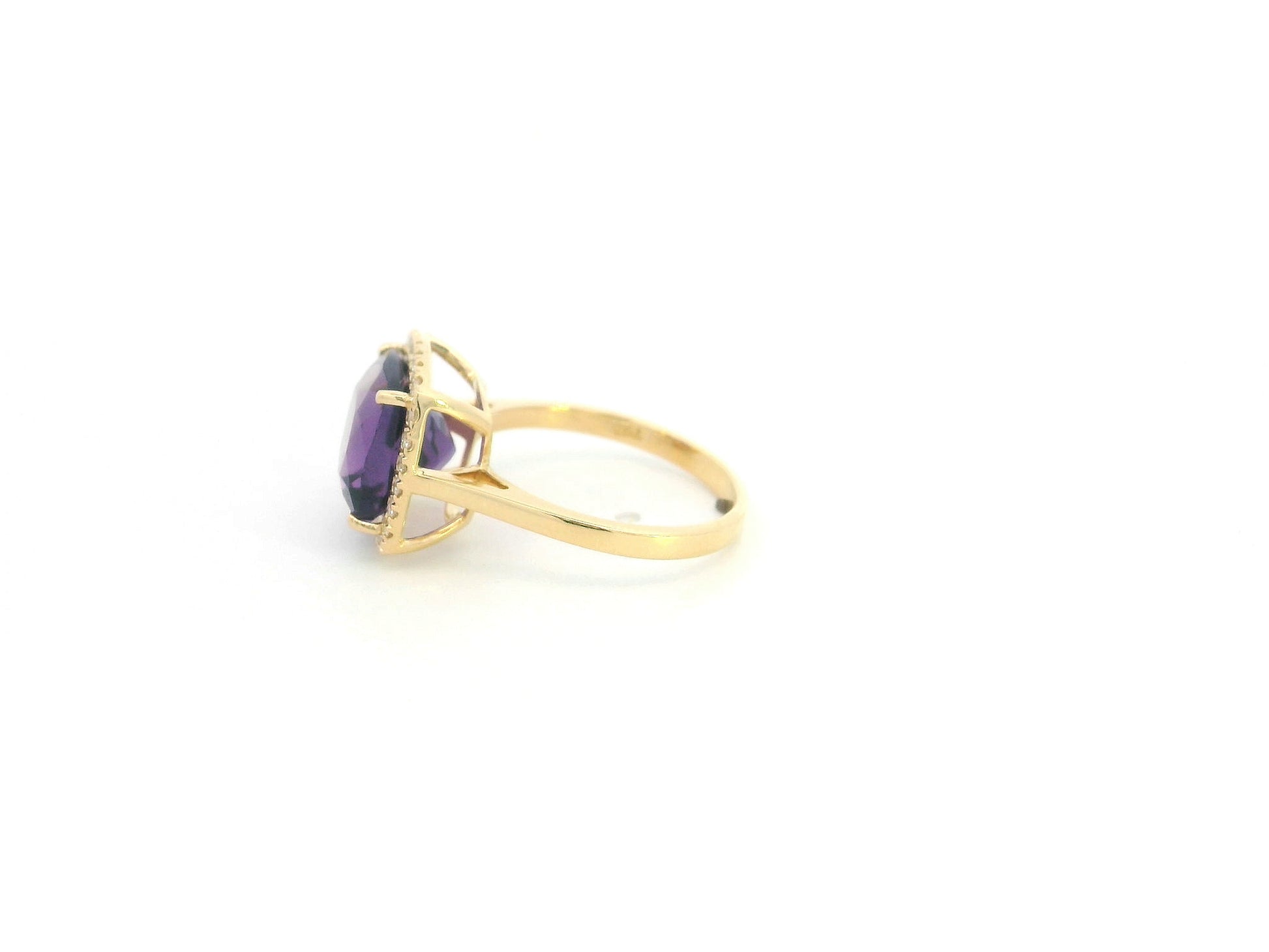 18K yellow gold cushion-cut amethyst halo ring with natural diamond accents.