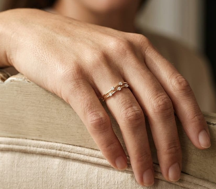 18K yellow gold split-band ring featuring five natural diamonds with a modern floating diamond design.
