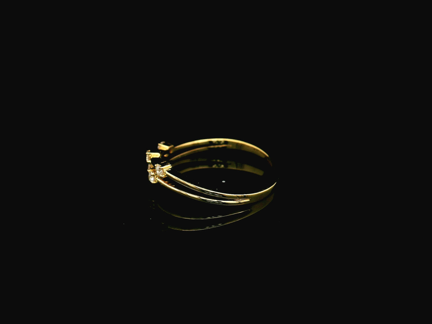 18K yellow gold split-band ring featuring five natural diamonds with a modern floating diamond design.