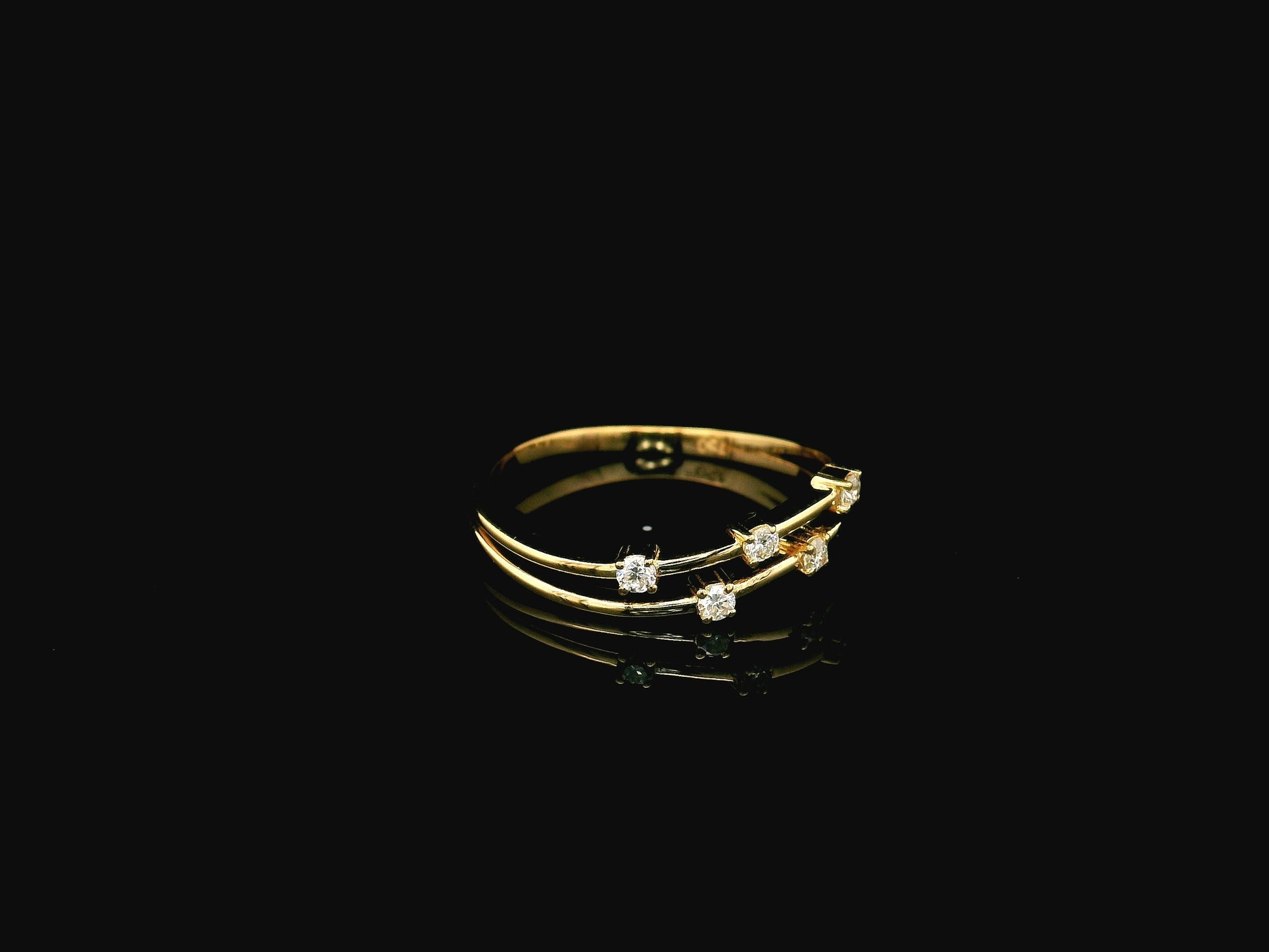 18K yellow gold split-band ring featuring five natural diamonds with a modern floating diamond design.