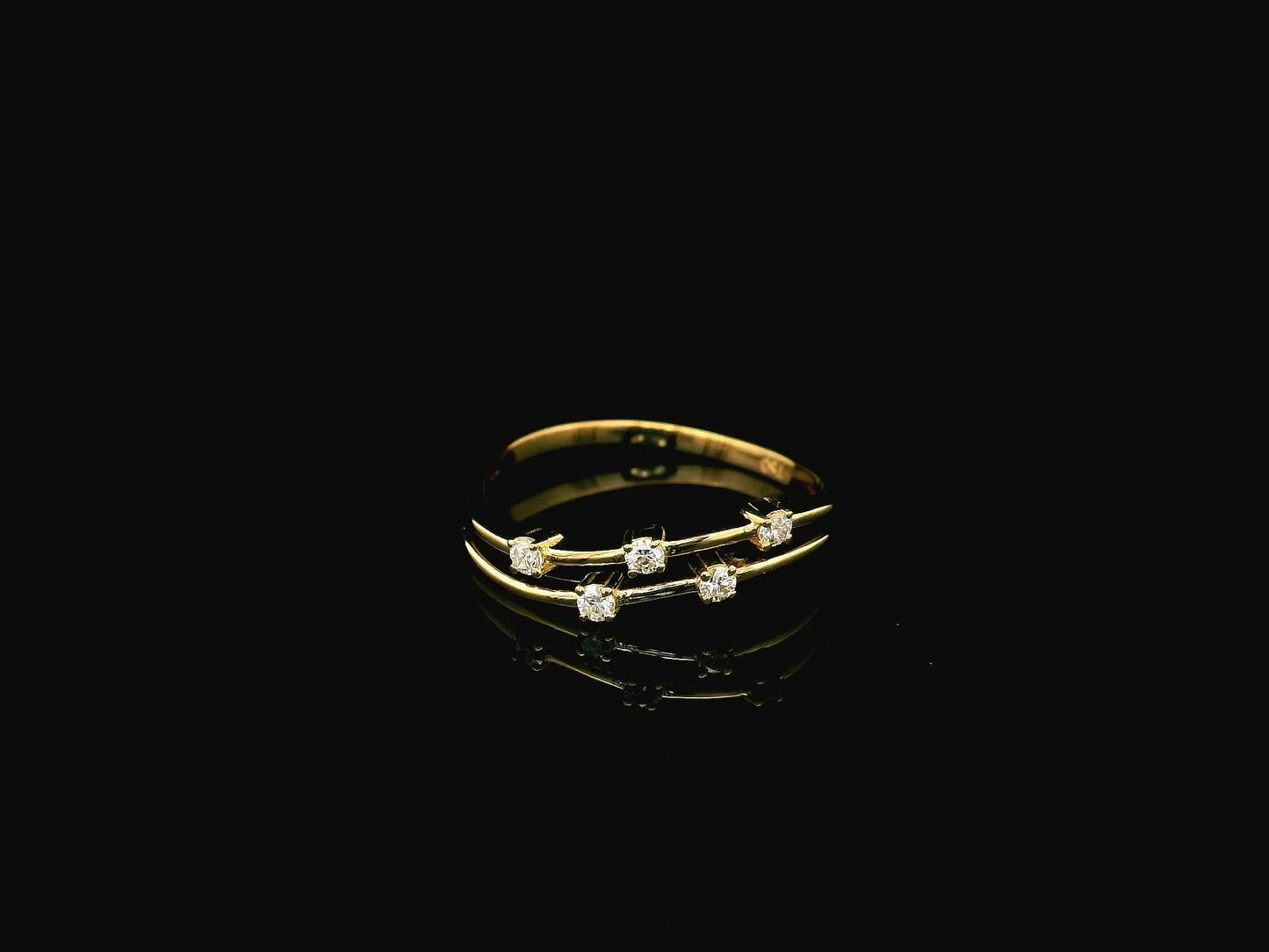 18K yellow gold split-band ring featuring five natural diamonds with a modern floating diamond design.