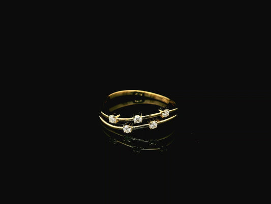 18K yellow gold split-band ring featuring five natural diamonds with a modern floating diamond design.