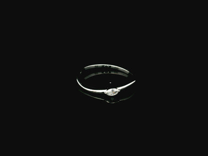 18K white gold solitaire ring featuring a 0.09 carat marquise cut natural diamond in a classic prong setting.