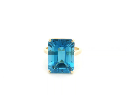 14.60 carat emerald cut London Blue Topaz solitaire ring in 18K yellow gold