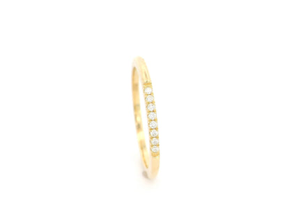 18K yellow gold slim diamond stacking ring featuring 0.06 carat natural diamonds in a minimalist band design