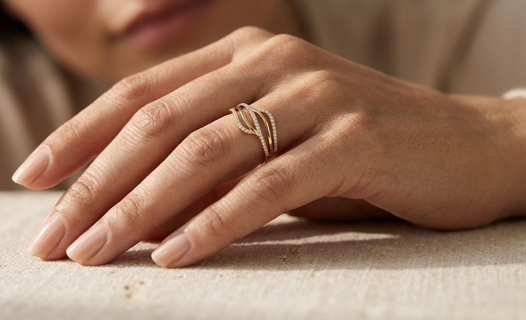 18K yellow gold wave diamond ring featuring a flowing multi-row design with 0.26 carat of round brilliant natural diamonds.