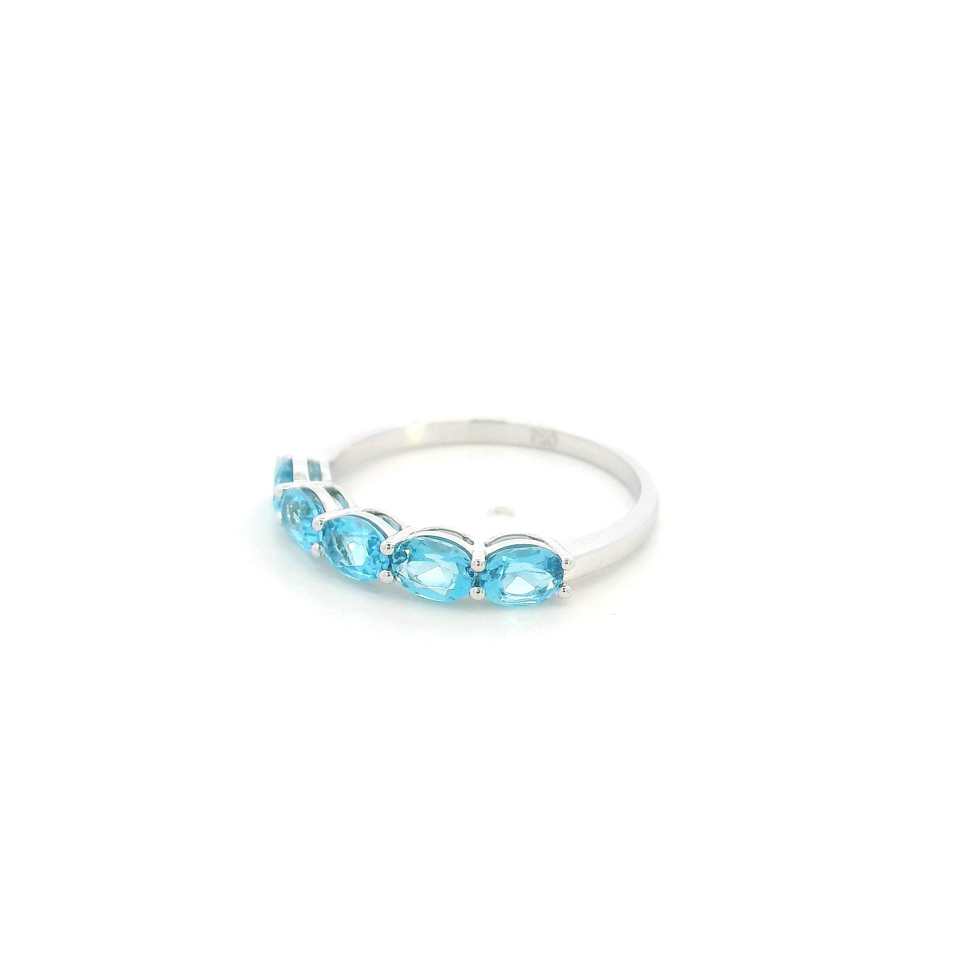 Blue Topaz five stone ring in 18K white gold featuring five oval blue topaz gemstones totaling 1.42 carats