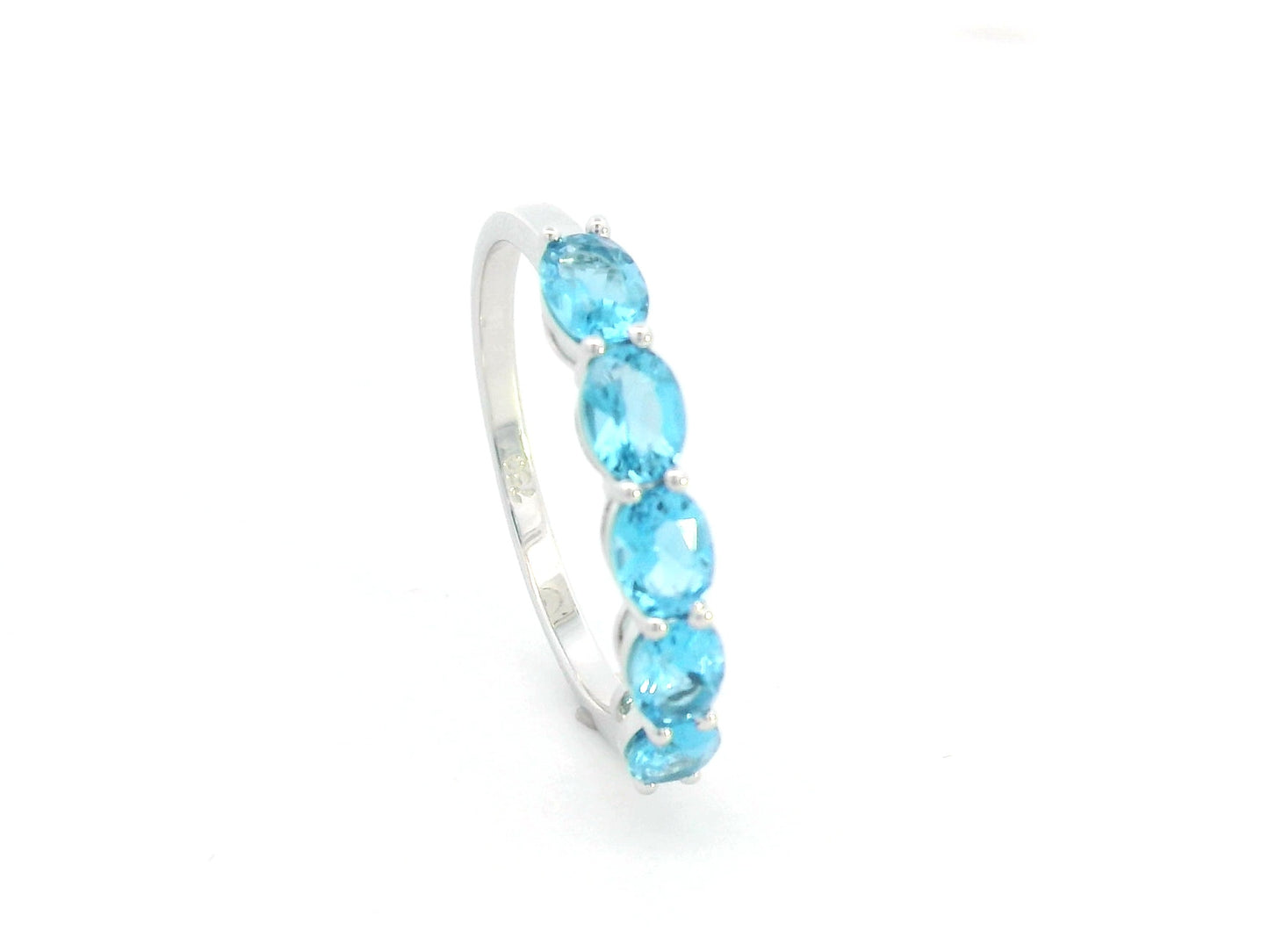 Blue Topaz five stone ring in 18K white gold featuring five oval blue topaz gemstones totaling 1.42 carats