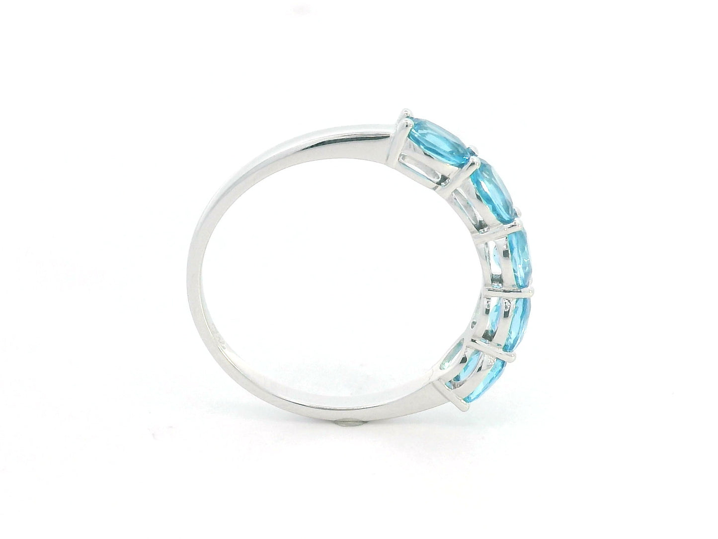 Blue Topaz five stone ring in 18K white gold featuring five oval blue topaz gemstones totaling 1.42 carats