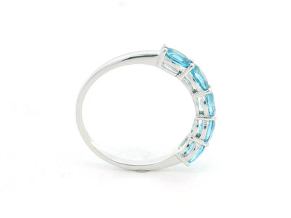 Blue Topaz five stone ring in 18K white gold featuring five oval blue topaz gemstones totaling 1.42 carats