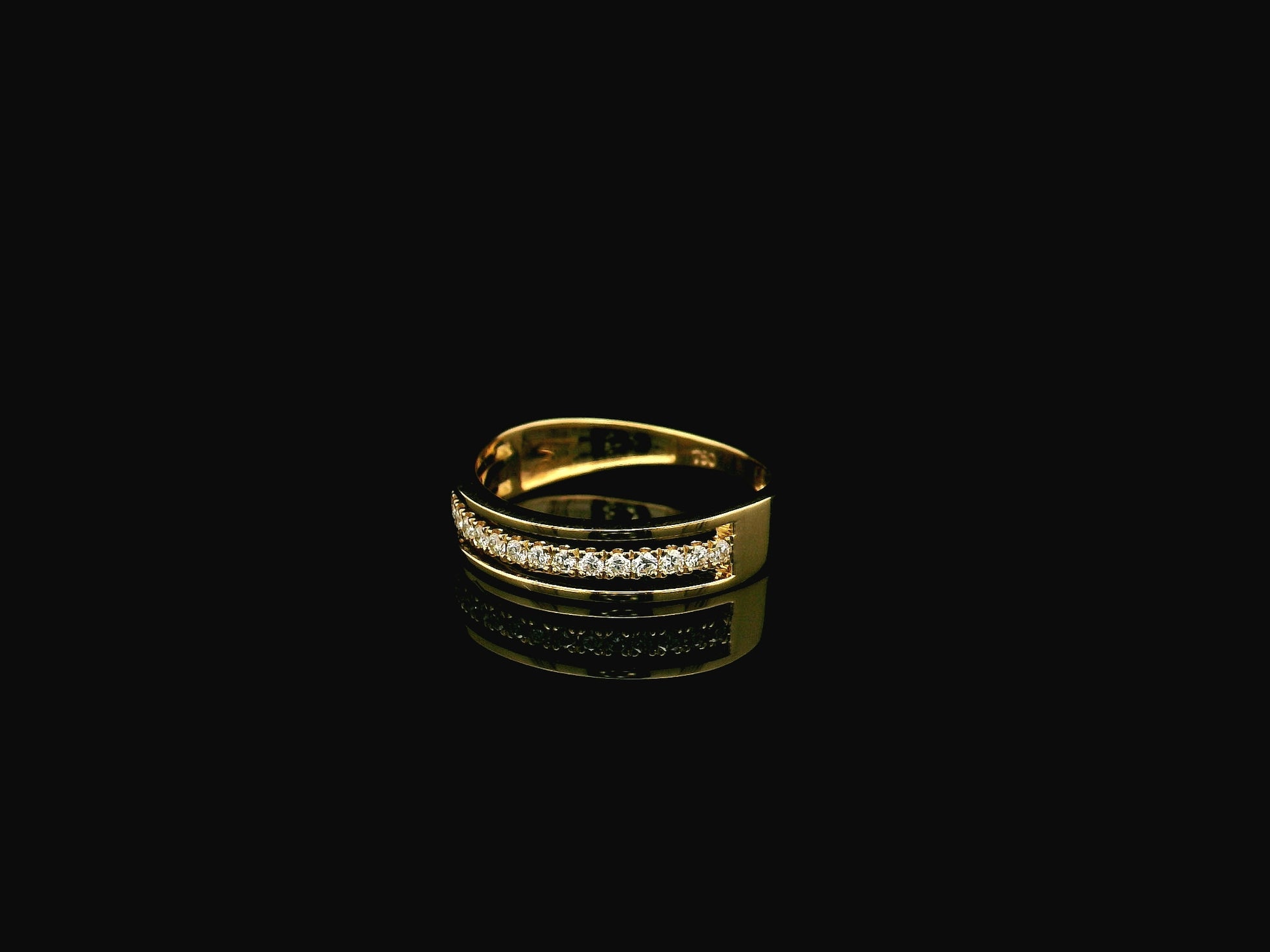 Diamond triple row band ring in 18K yellow gold with 0.25 carat natural diamonds and contemporary layered openwork design.