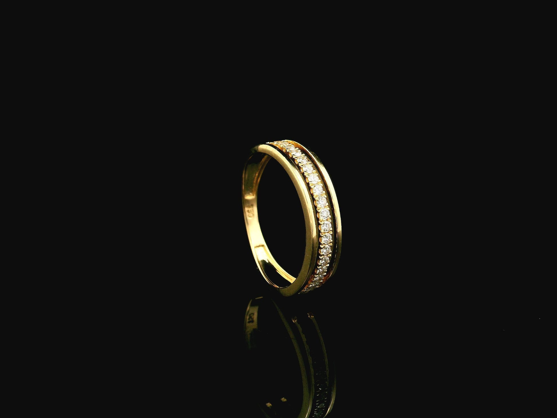 Diamond triple row band ring in 18K yellow gold with 0.25 carat natural diamonds and contemporary layered openwork design.