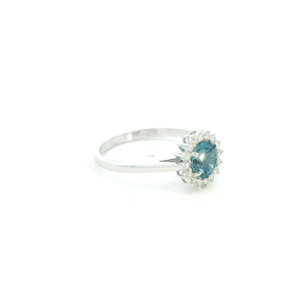 London Blue Topaz halo ring in 18K white gold with diamond floral halo and 0.93 carat center stone