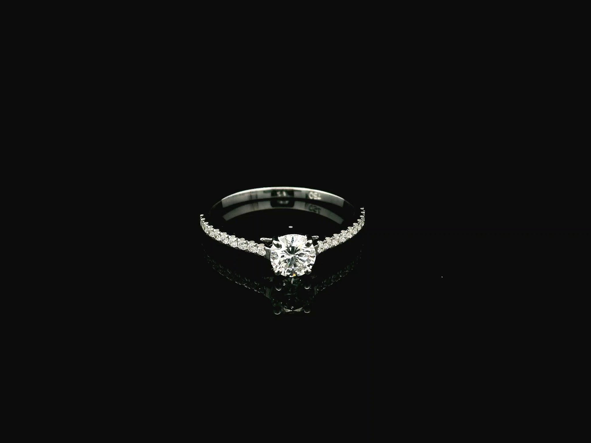 GIA certified 0.50 carat round diamond solitaire engagement ring in 18K white gold with diamond pavé band