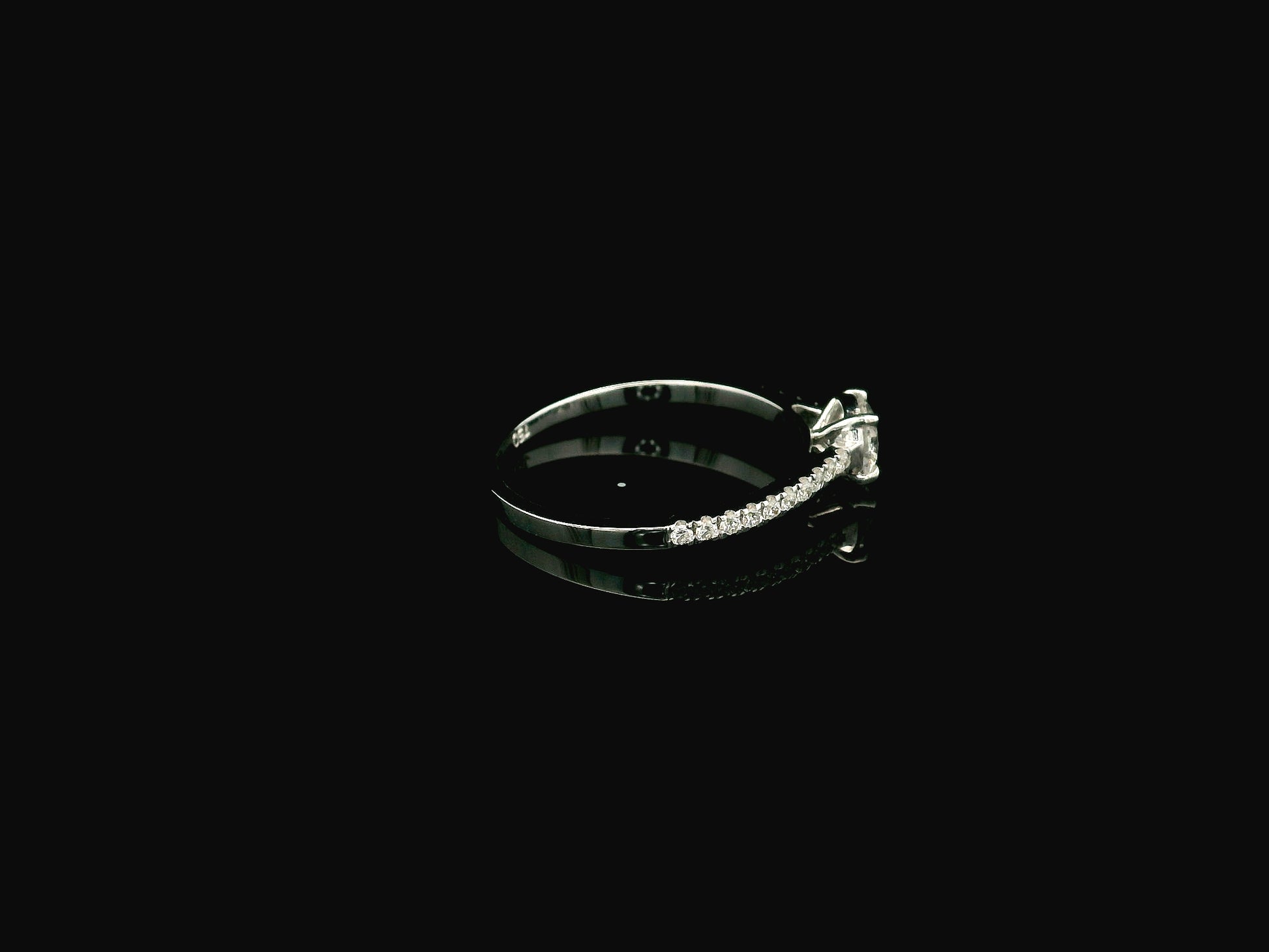 GIA certified 0.50 carat round diamond solitaire engagement ring in 18K white gold with diamond pavé band