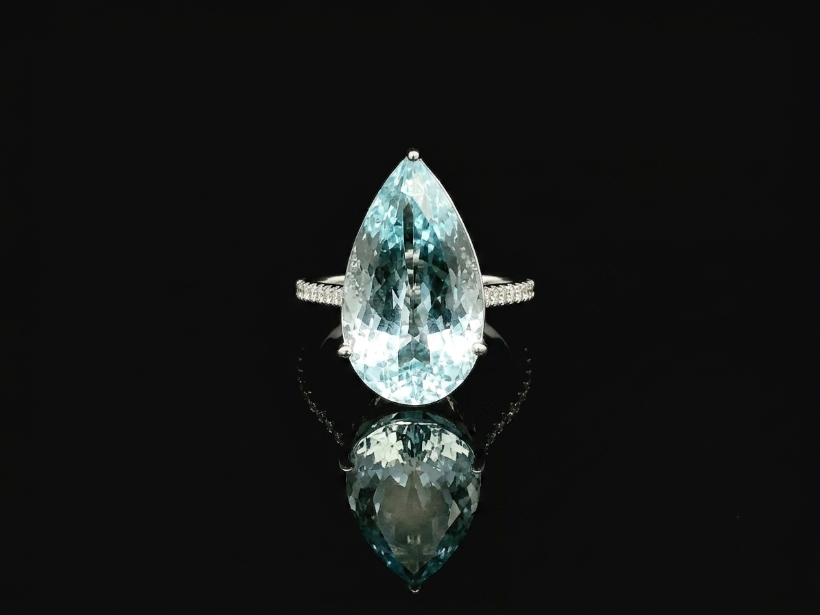 15.60 carat pear cut aquamarine ring in 18K white gold with pavé diamond band