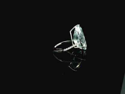 15.60 carat pear cut aquamarine ring in 18K white gold with pavé diamond band