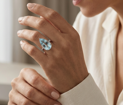 15.60 carat pear cut aquamarine ring in 18K white gold with pavé diamond band