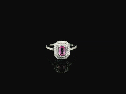 18K white gold pink sapphire halo ring featuring a 0.55 carat emerald-cut pink sapphire surrounded by a double halo of natural diamonds totaling 0.40 carat.