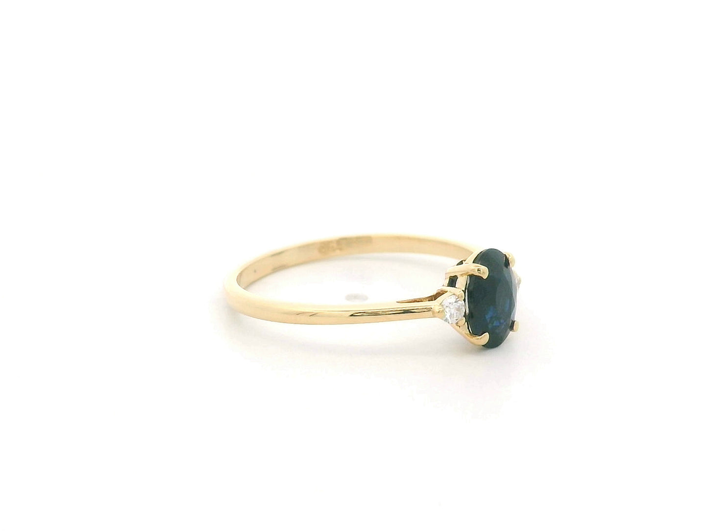 Oval blue sapphire and diamond three stone ring in 18K yellow gold