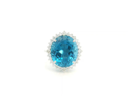 9.81 carat oval London Blue Topaz halo ring with natural diamonds in 18K white gold.