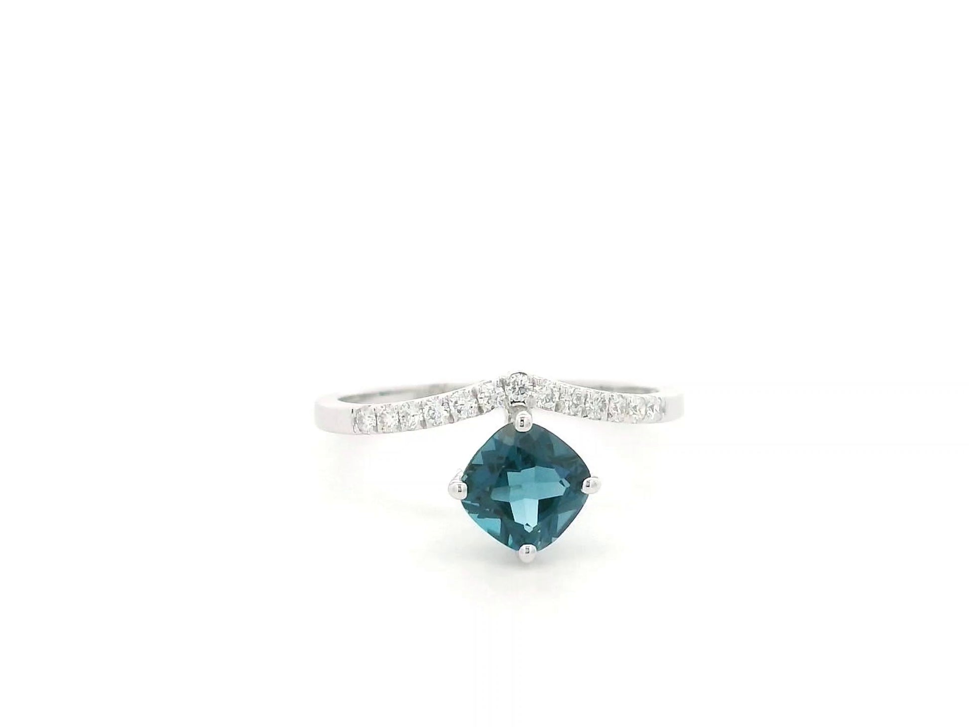 18K white gold London Blue Topaz ring featuring a 1.00 carat oval London Blue Topaz with 0.18 carat natural diamond accents on an elegant diamond-set band.