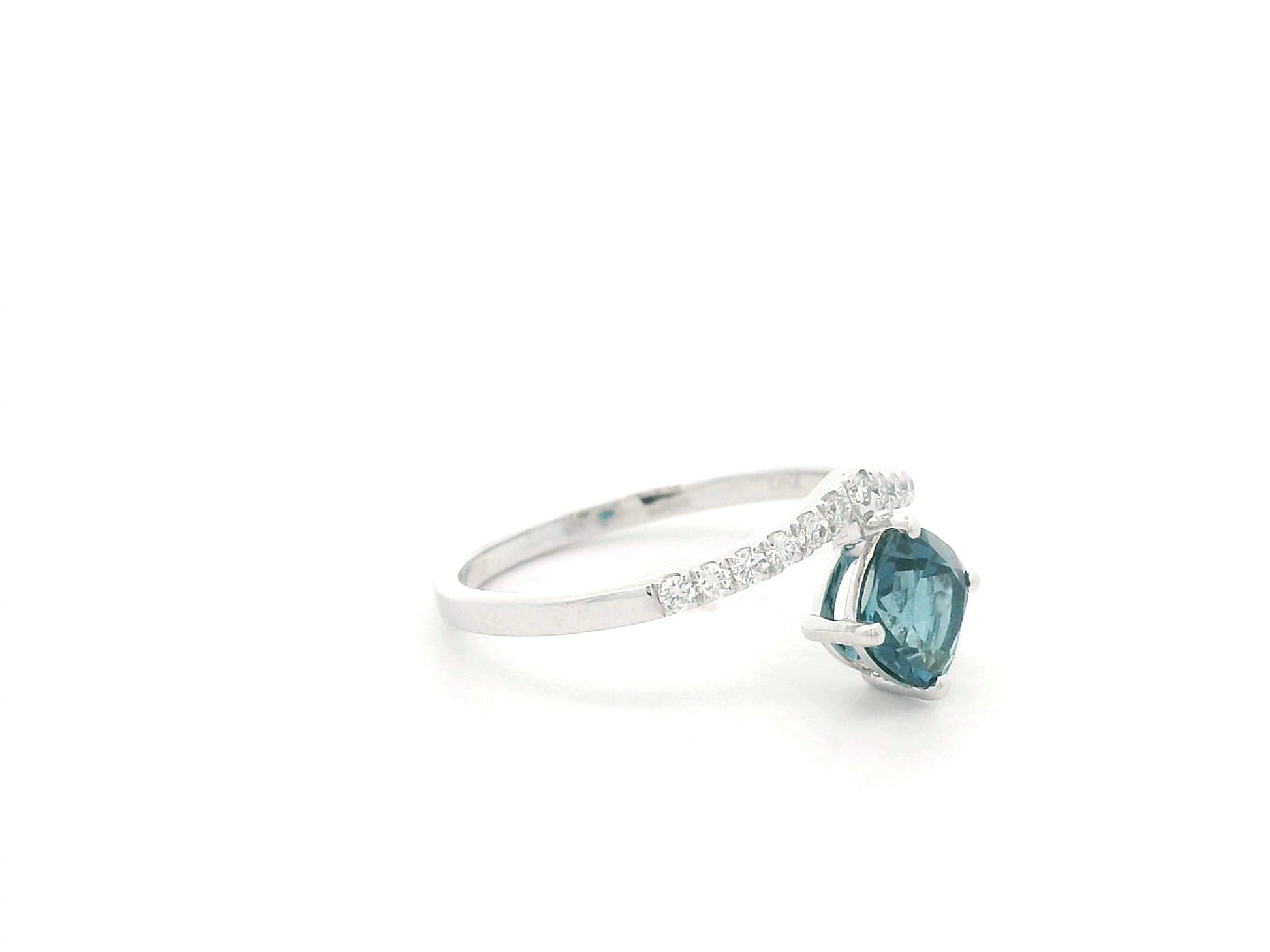 18K white gold London Blue Topaz ring featuring a 1.00 carat oval London Blue Topaz with 0.18 carat natural diamond accents on an elegant diamond-set band.
