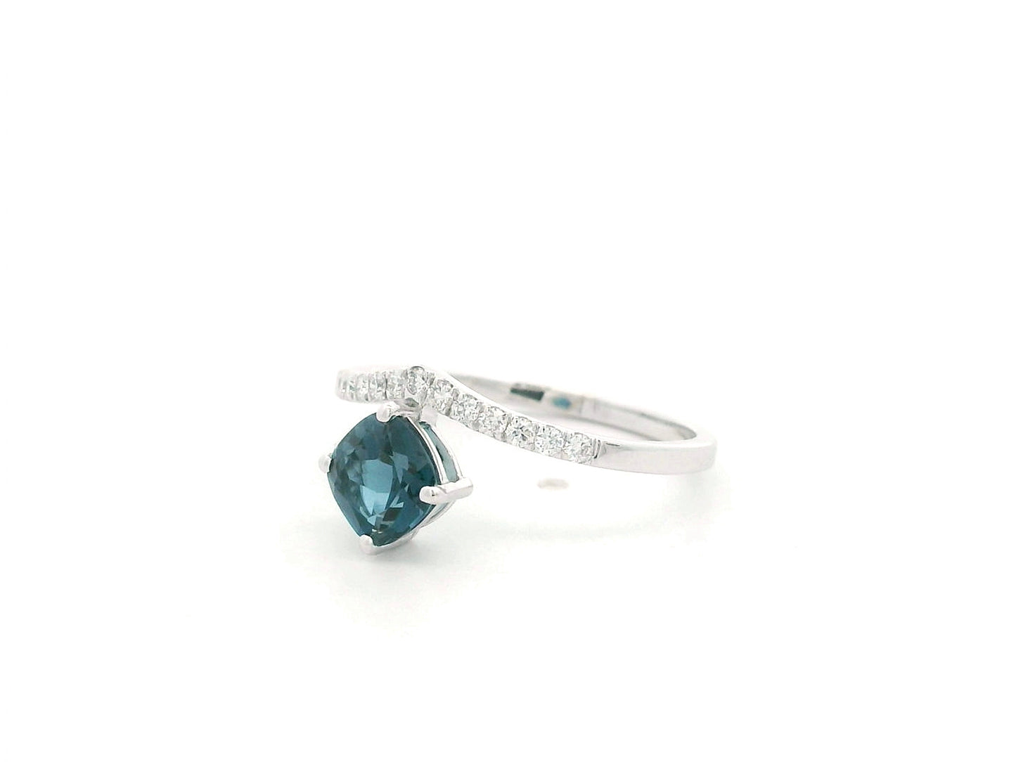 18K white gold London Blue Topaz ring featuring a 1.00 carat oval London Blue Topaz with 0.18 carat natural diamond accents on an elegant diamond-set band.