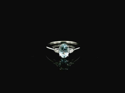 Oval aquamarine and diamond three stone ring in 18K white gold