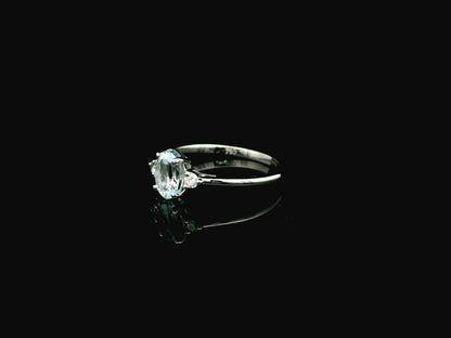 Oval aquamarine and diamond three stone ring in 18K white gold