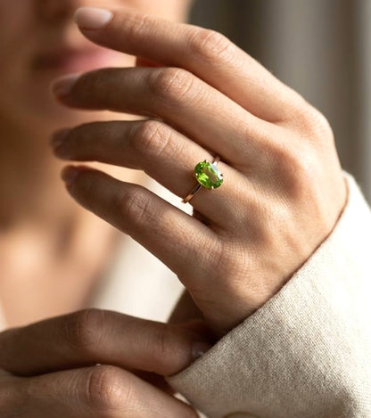 18K yellow gold oval peridot solitaire ring featuring a 2.17 carat natural peridot gemstone