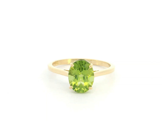 18K yellow gold oval peridot solitaire ring featuring a 2.17 carat natural peridot gemstone