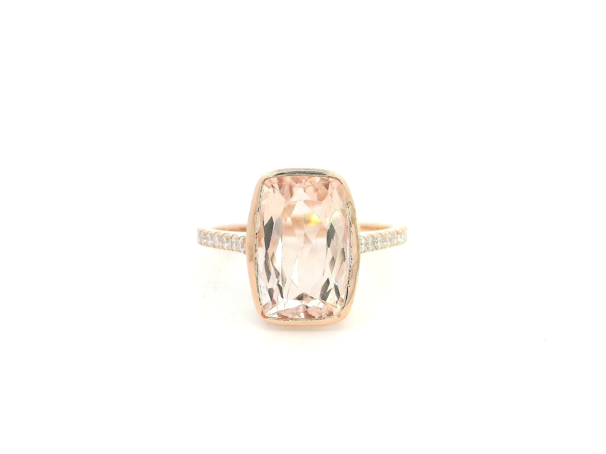 Emerald cut Morganite bezel set ring in 18K rose gold with diamond pavé band