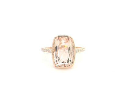 Emerald cut Morganite bezel set ring in 18K rose gold with diamond pavé band