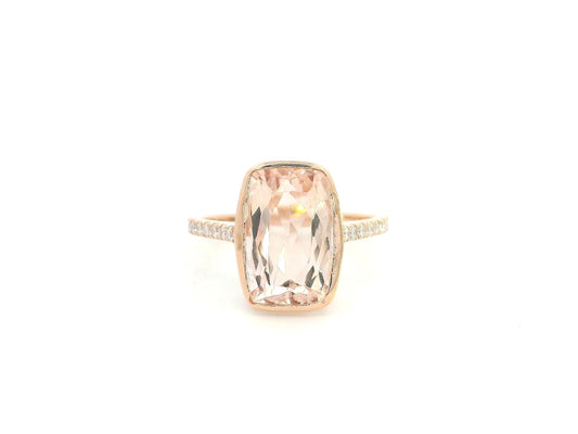 Emerald cut Morganite bezel set ring in 18K rose gold with diamond pavé band