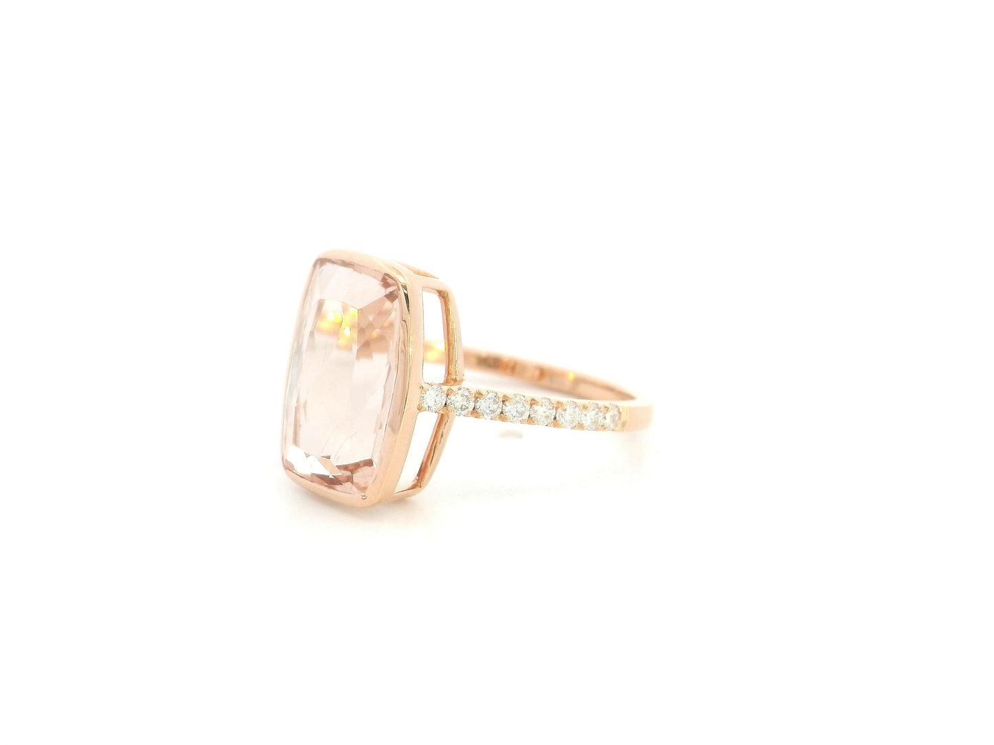 Emerald cut Morganite bezel set ring in 18K rose gold with diamond pavé band