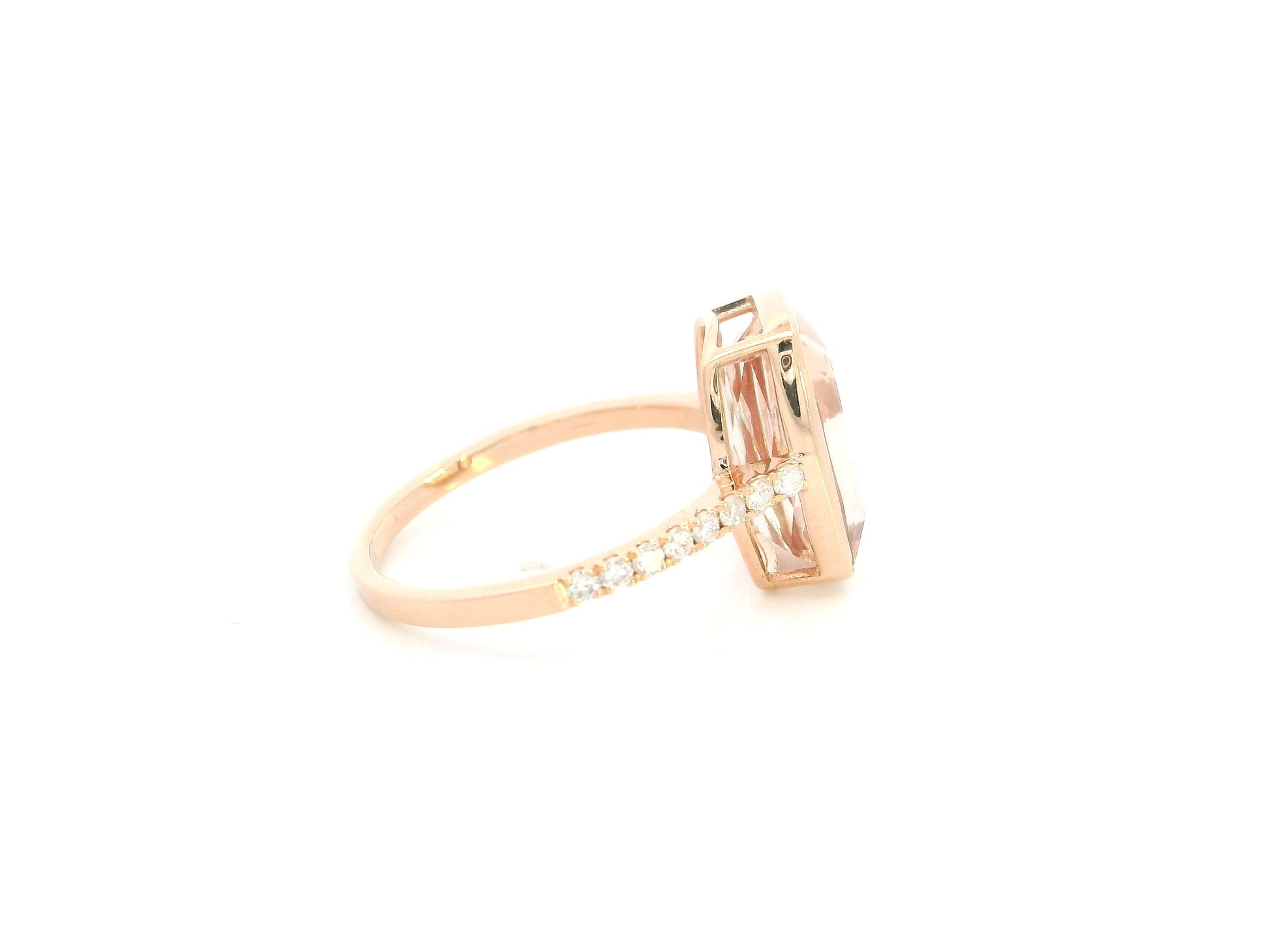 Emerald cut Morganite bezel set ring in 18K rose gold with diamond pavé band