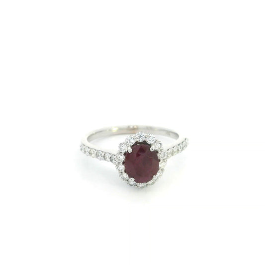 18K white gold ruby diamond halo ring featuring a 1.58 carat natural oval ruby surrounded by 0.75 carats of natural diamonds.