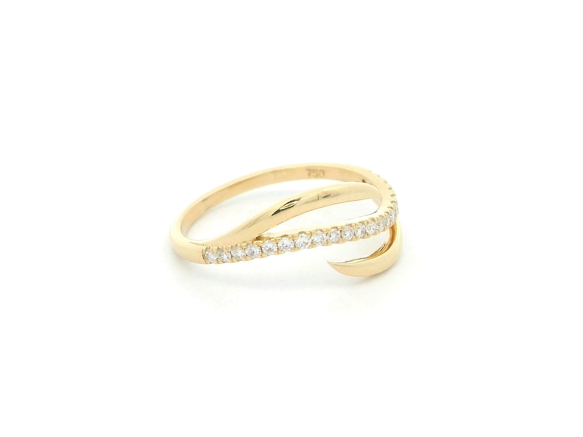 18K yellow gold diamond crossover ring featuring a flowing twist design set with 0.21 carat natural diamonds.