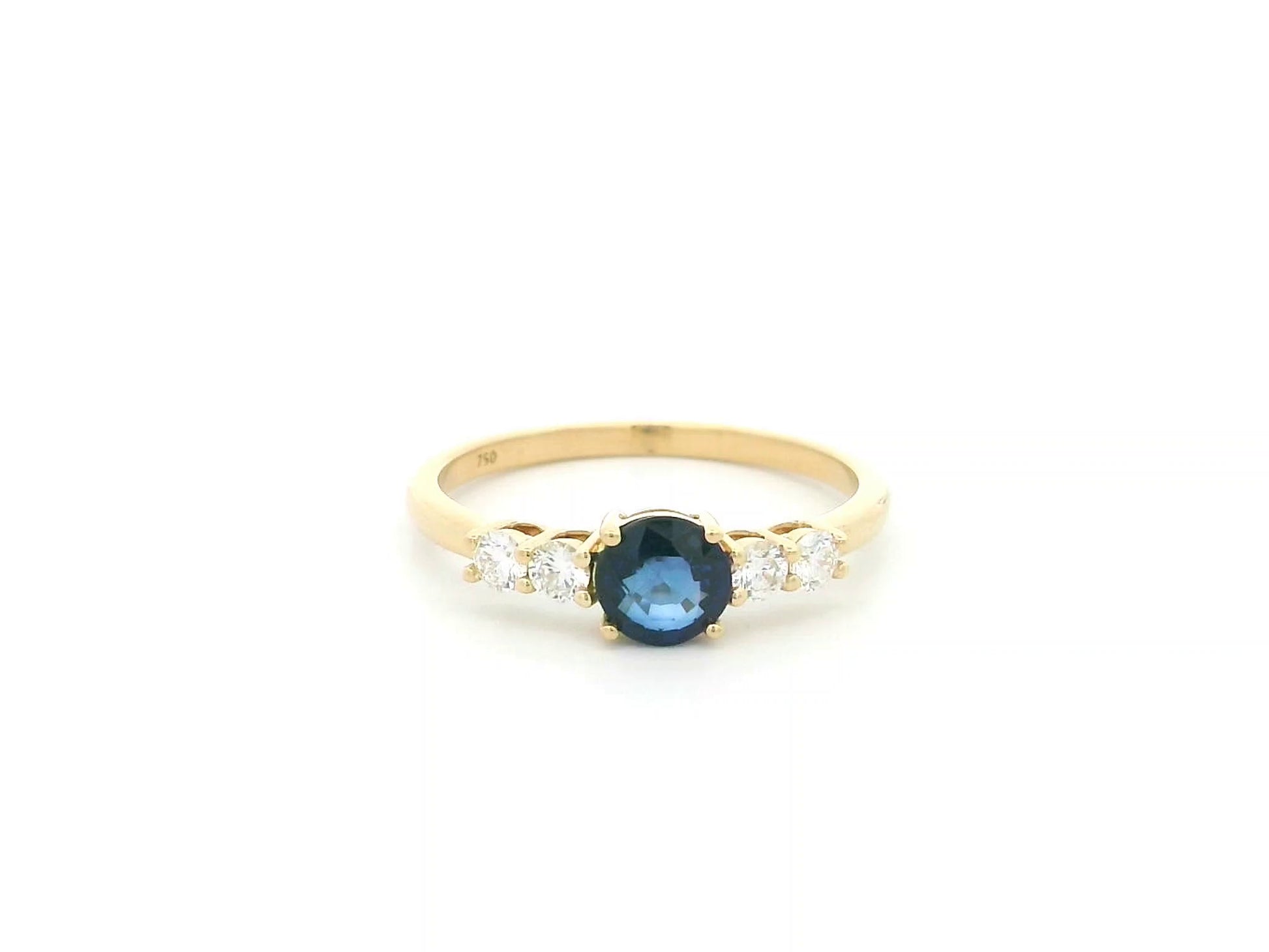 Natural Blue Sapphire and Diamond Ring in 18K Yellow Gold featuring a 0.65 carat round blue sapphire with 0.25 carat natural diamond side stones.