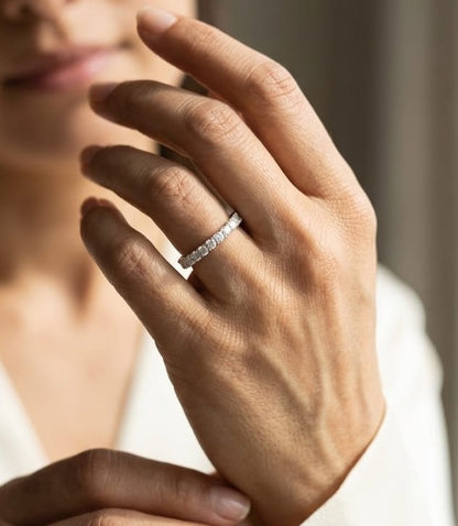 18K white gold full eternity diamond ring featuring 1.88 carats of natural round brilliant diamonds in prong setting, handcrafted as a made-to-order wedding band.