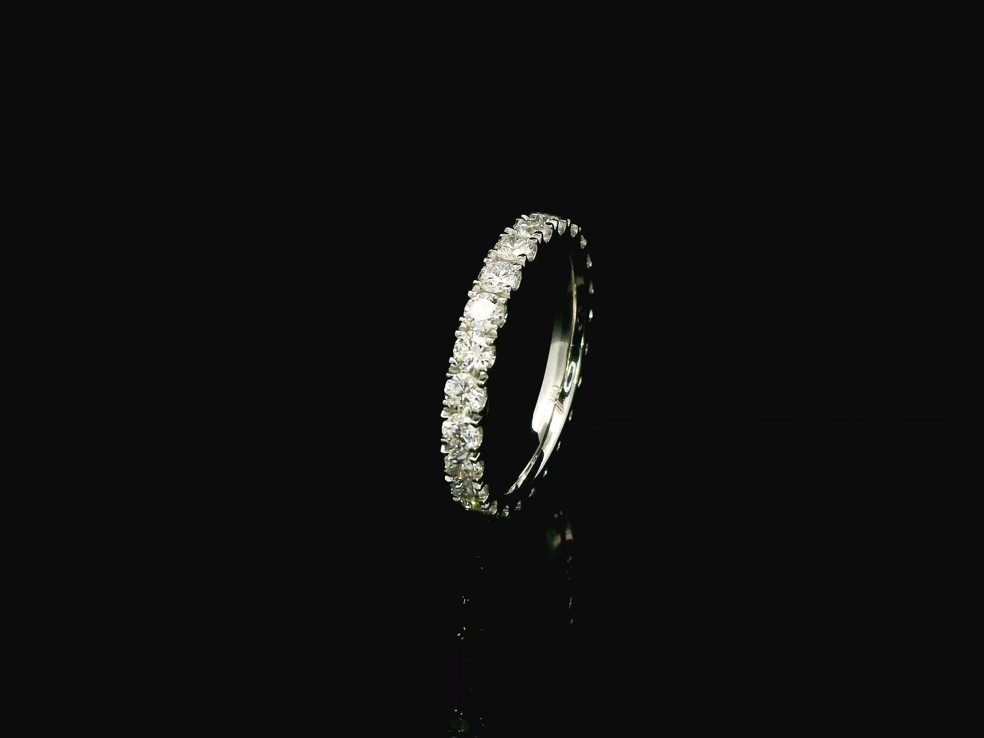 18K white gold full eternity diamond ring featuring 1.88 carats of natural round brilliant diamonds in prong setting, handcrafted as a made-to-order wedding band.