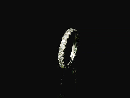 18K white gold full eternity diamond ring featuring 1.88 carats of natural round brilliant diamonds in prong setting, handcrafted as a made-to-order wedding band.