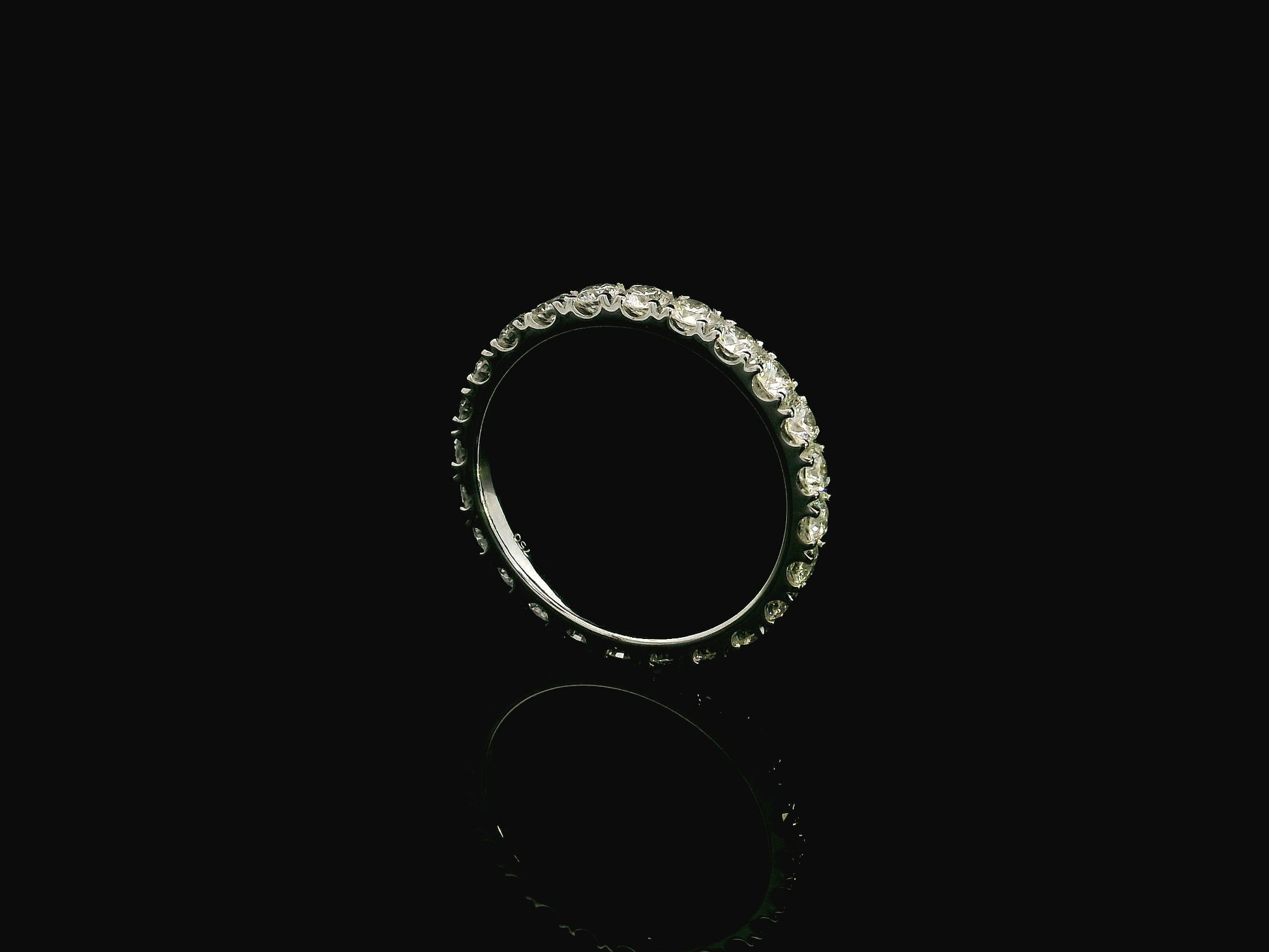 18K white gold full eternity diamond ring featuring 1.88 carats of natural round brilliant diamonds in prong setting, handcrafted as a made-to-order wedding band.